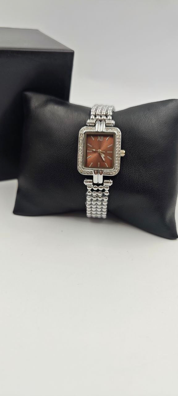 GÜMÜŞ RENK İÇİ TURUNCU BAYAN SAATİ